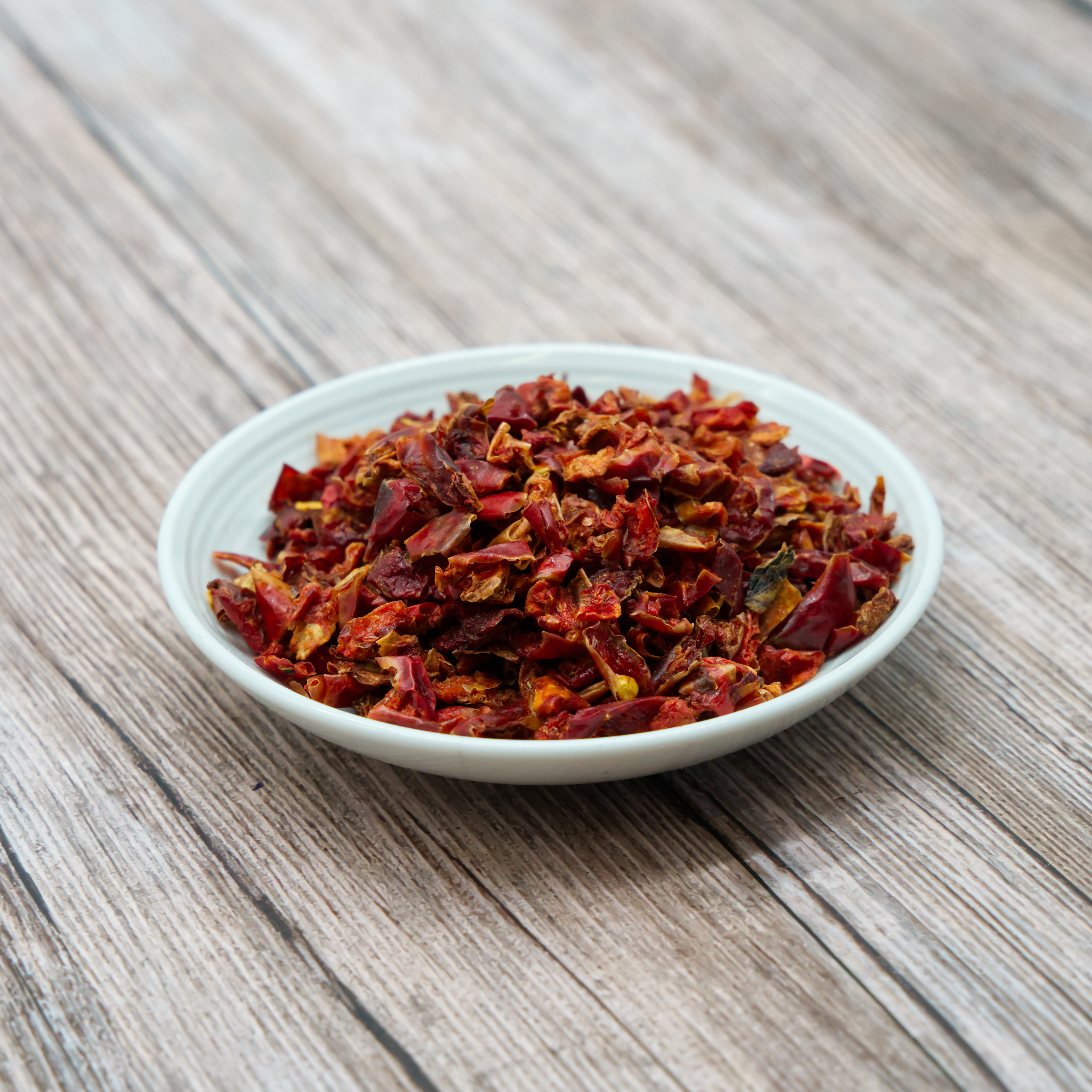 paprika-rot-einzelfutter-fuer-voegel-koernerbude Paprikaflocken, rot getrocknet